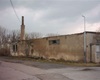 Areál "technických služeb" v ul. K Lázním před demolicí v roce 2006.