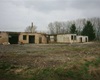 Areál "technických služeb" v ul. K Lázním před demolicí v roce 2006.